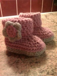 Pink and grey, hand crocheted, booties.