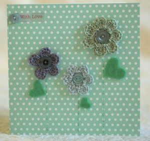Hand made and hand stitched, green and grey crocheted flowers and green felt leaves greetings card. Left blank inside for your own message. Size w15.2 x h15.2cm