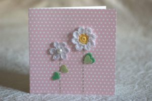 Hand made and hand stitched, white crocheted flower and green felt leaves greetings card. Left blank inside for your own message. Size w15.2 x h15.2cm. £3.50