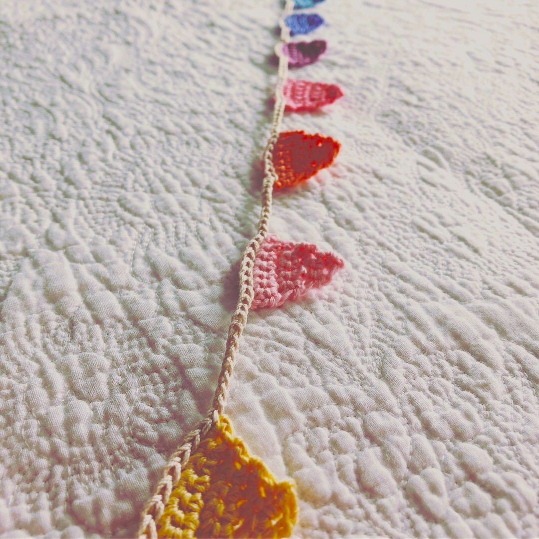 Tiny crocheted bunting.