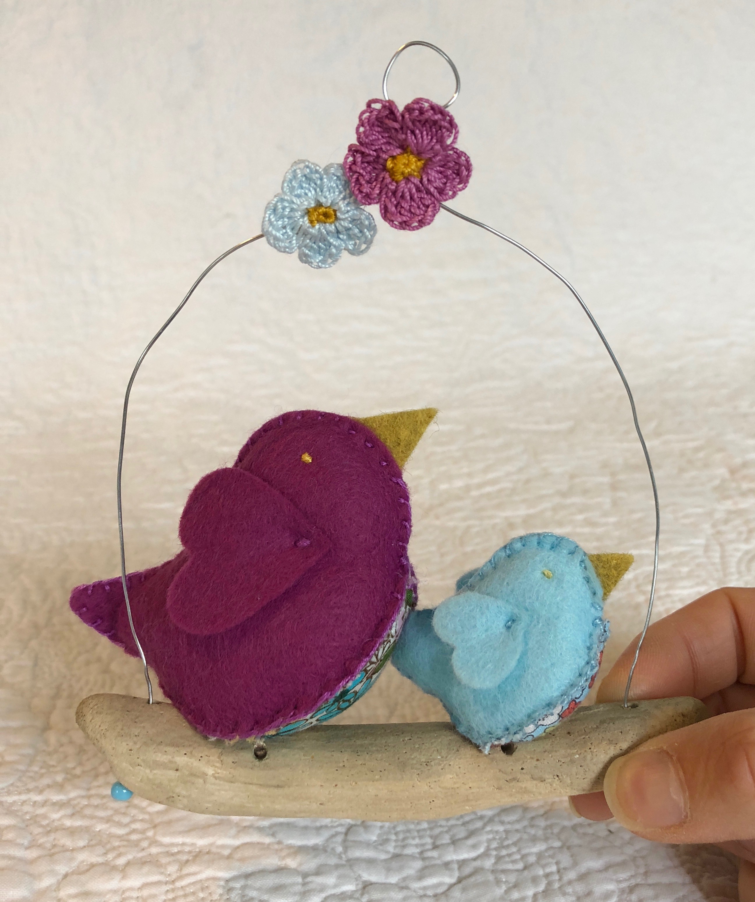 Hanging decoration. Hand sewn felt and floral cotton fabric little birds on a driftwood branch.