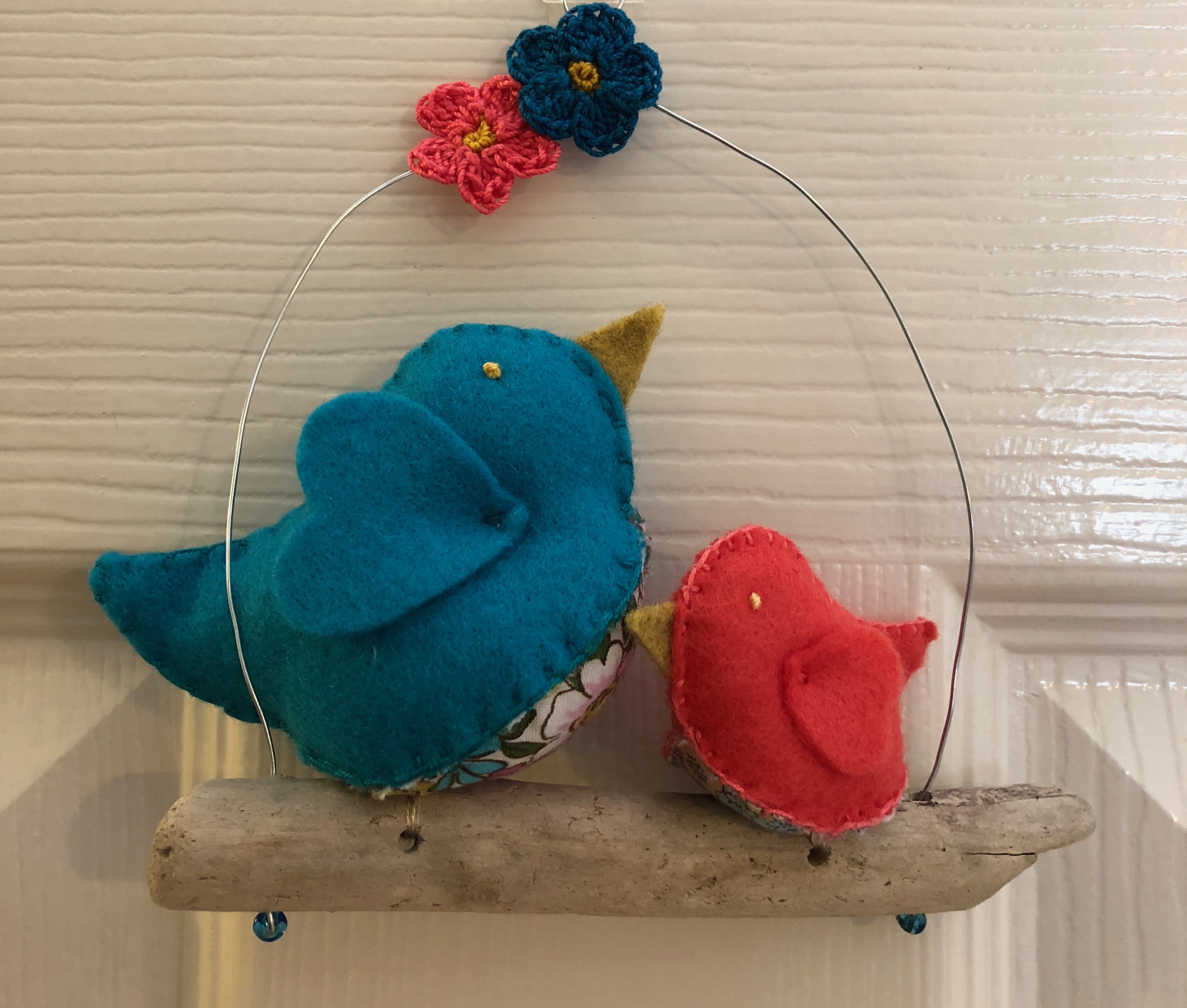 Hanging decoration. Hand sewn Turquoise and coral felt and floral cotton fabric little birds on a driftwood branch.