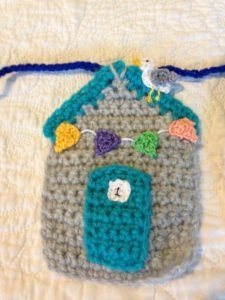 Crocheted beach hut bunting.