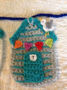 Crocheted beach hut bunting.