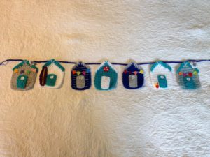 Crocheted beach hut bunting.