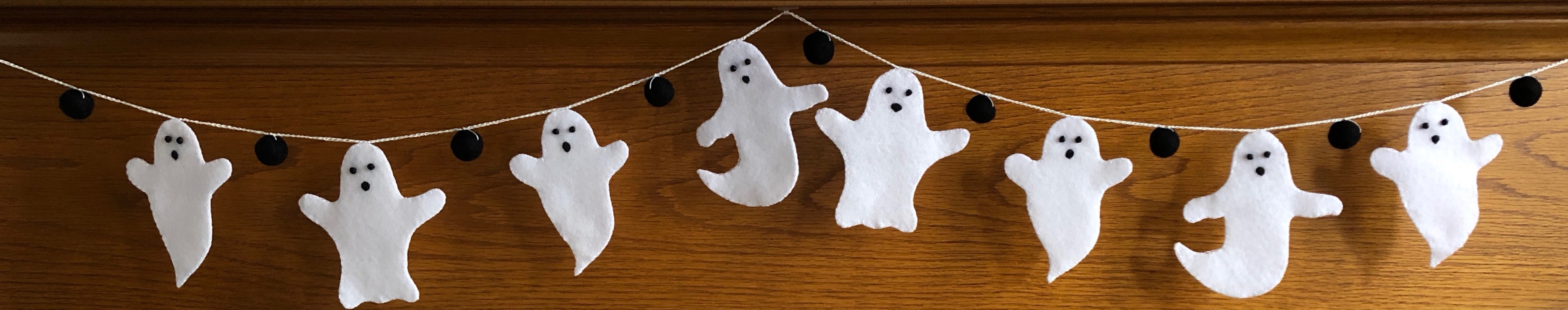 White felt ghosts and black felt pom-pom hand stitched garland.