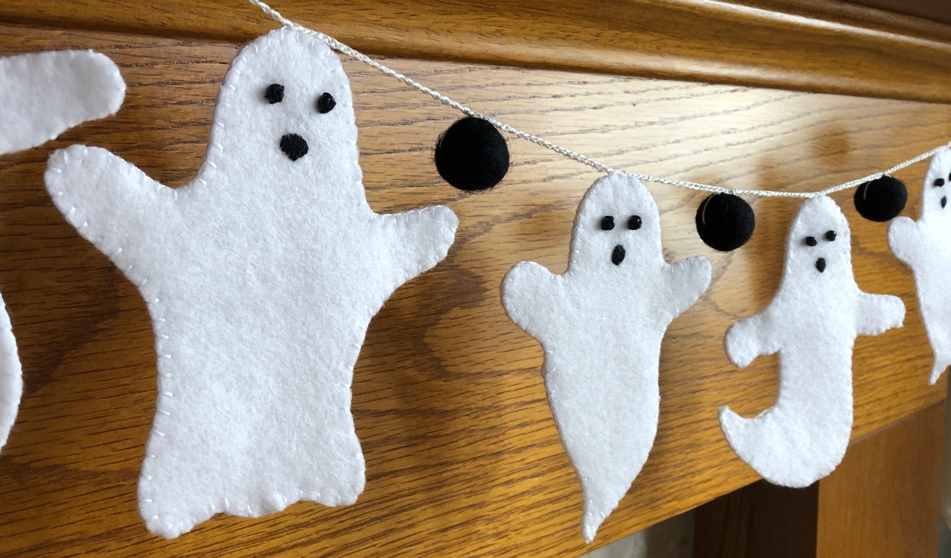 White felt ghosts and black felt pom-pom hand stitched garland.