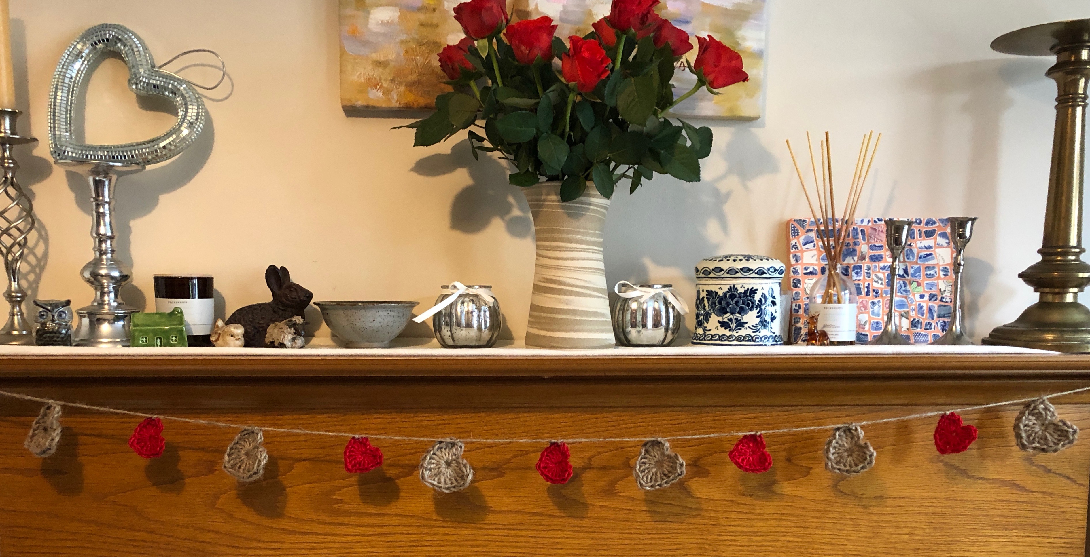 Jute twine, crocheted heart garland with medium sized natural and small red twine hearts.