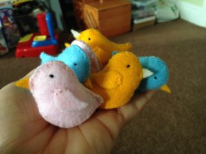 Tiny hand sewn felt birds.