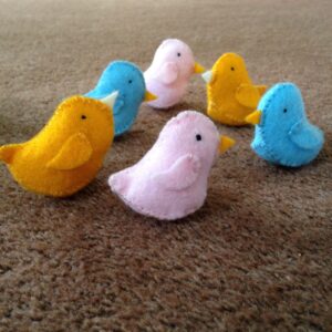 Tiny hand sewn felt birds.