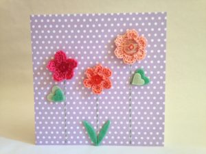 Hand made and hand stitched, pink and peach crocheted flowers and green felt leaves greetings card. Left blank inside for your own message. Size w15.2 x h15.2cm