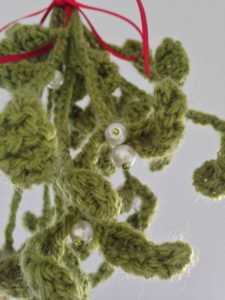 Hanging crochet mistletoe decoration.