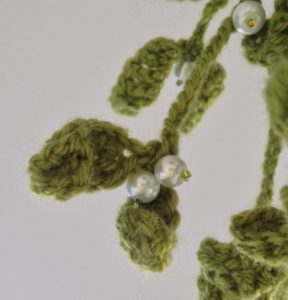 Hanging crochet mistletoe decoration.