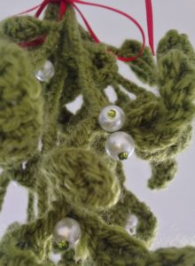 Hanging crochet mistletoe decoration.