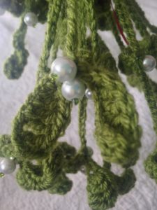Hanging crochet mistletoe decoration.