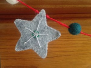 Hand embroidered felt star.