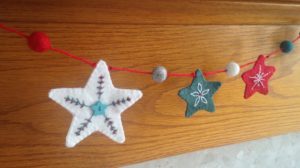 Hand embroidered felt stars.