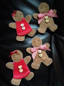 Gingerbread men and women, felt, hand stitched, hanging decorations.