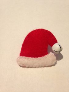 Red and white, hand stitched, felt, Santa hat brooch.