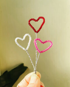 Wire and glass bead, red, pink and clear hearts.