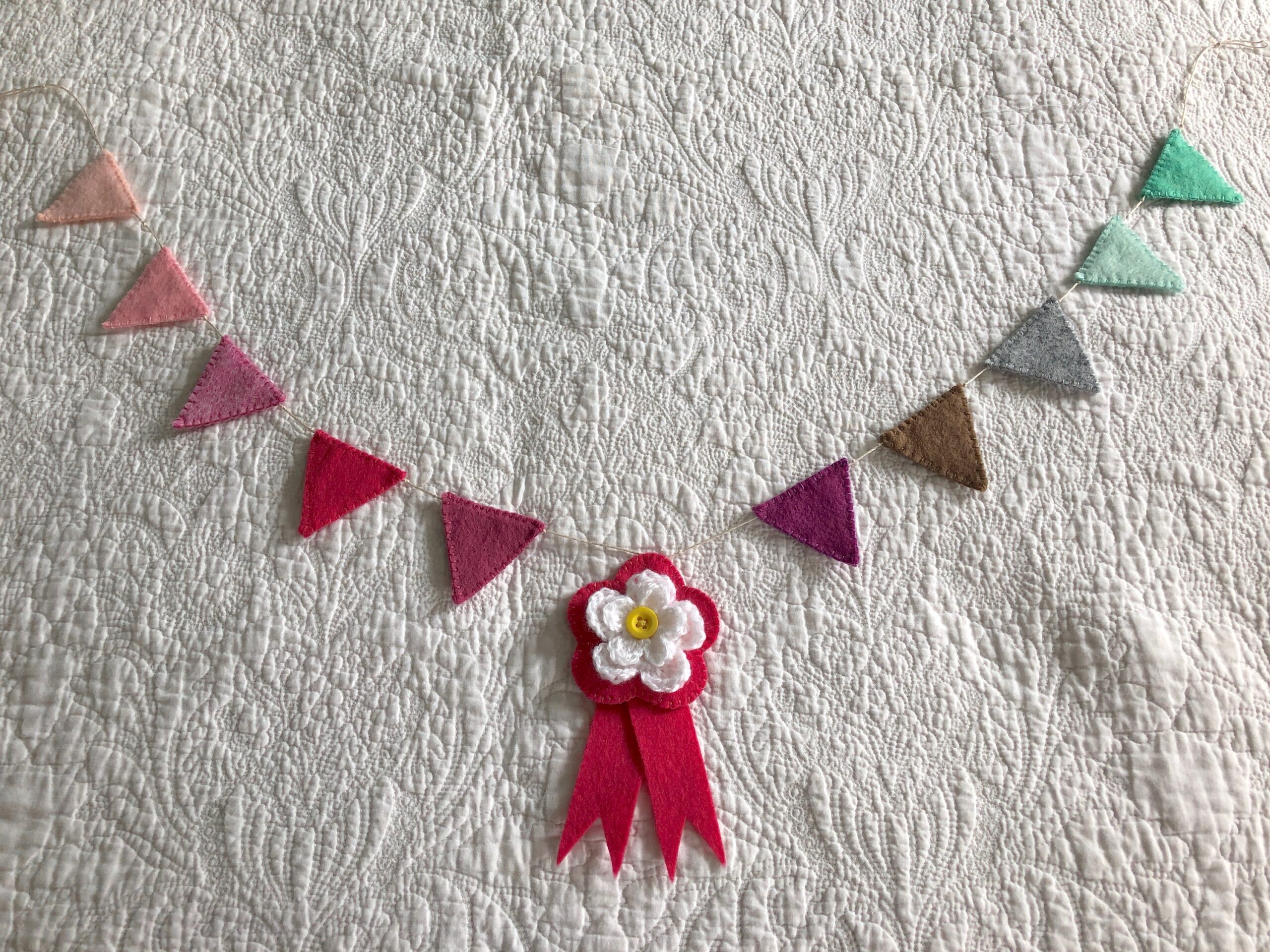 Felt bunting and crocheted flower rosette.