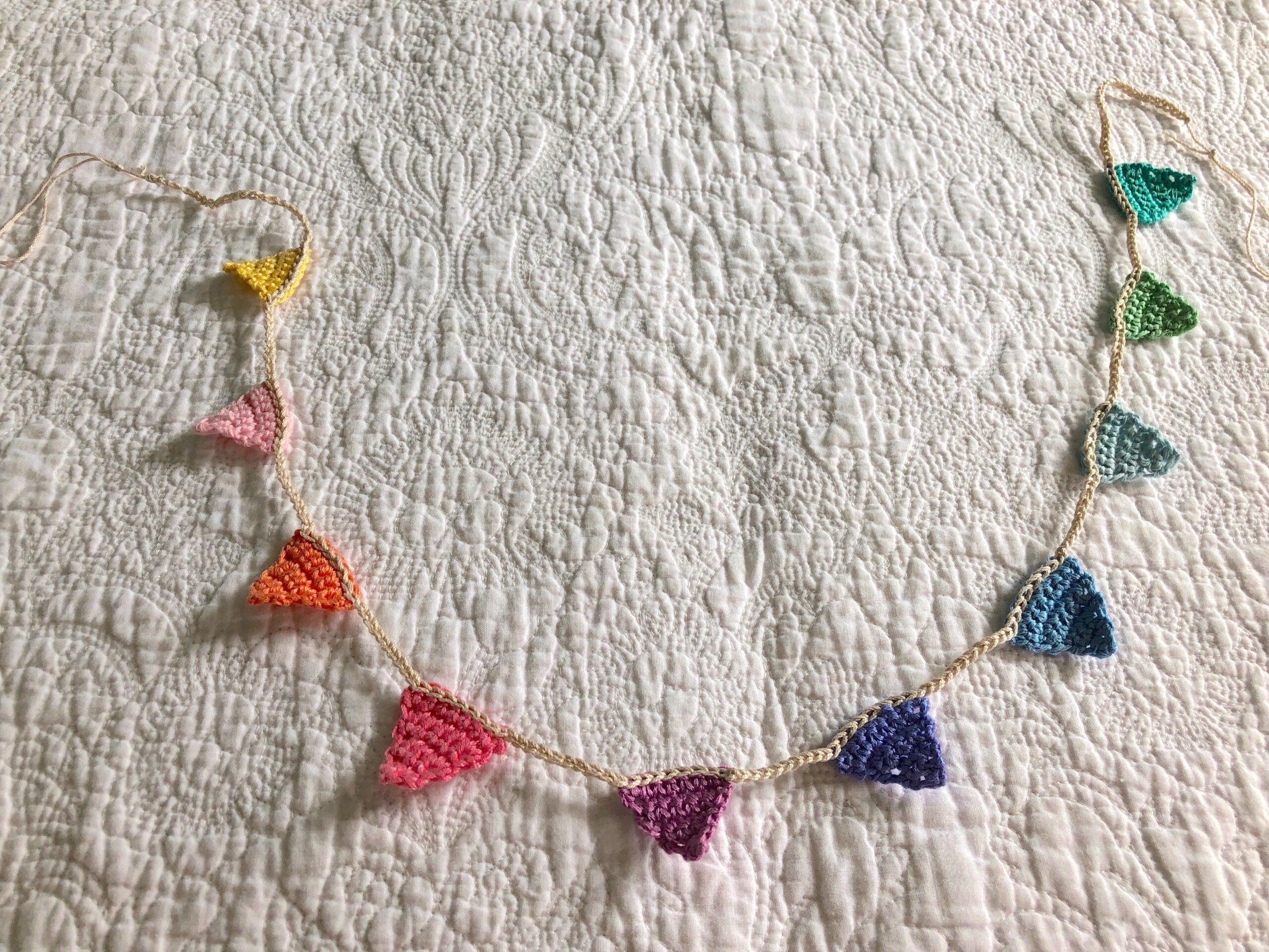 Tiny crocheted bunting.