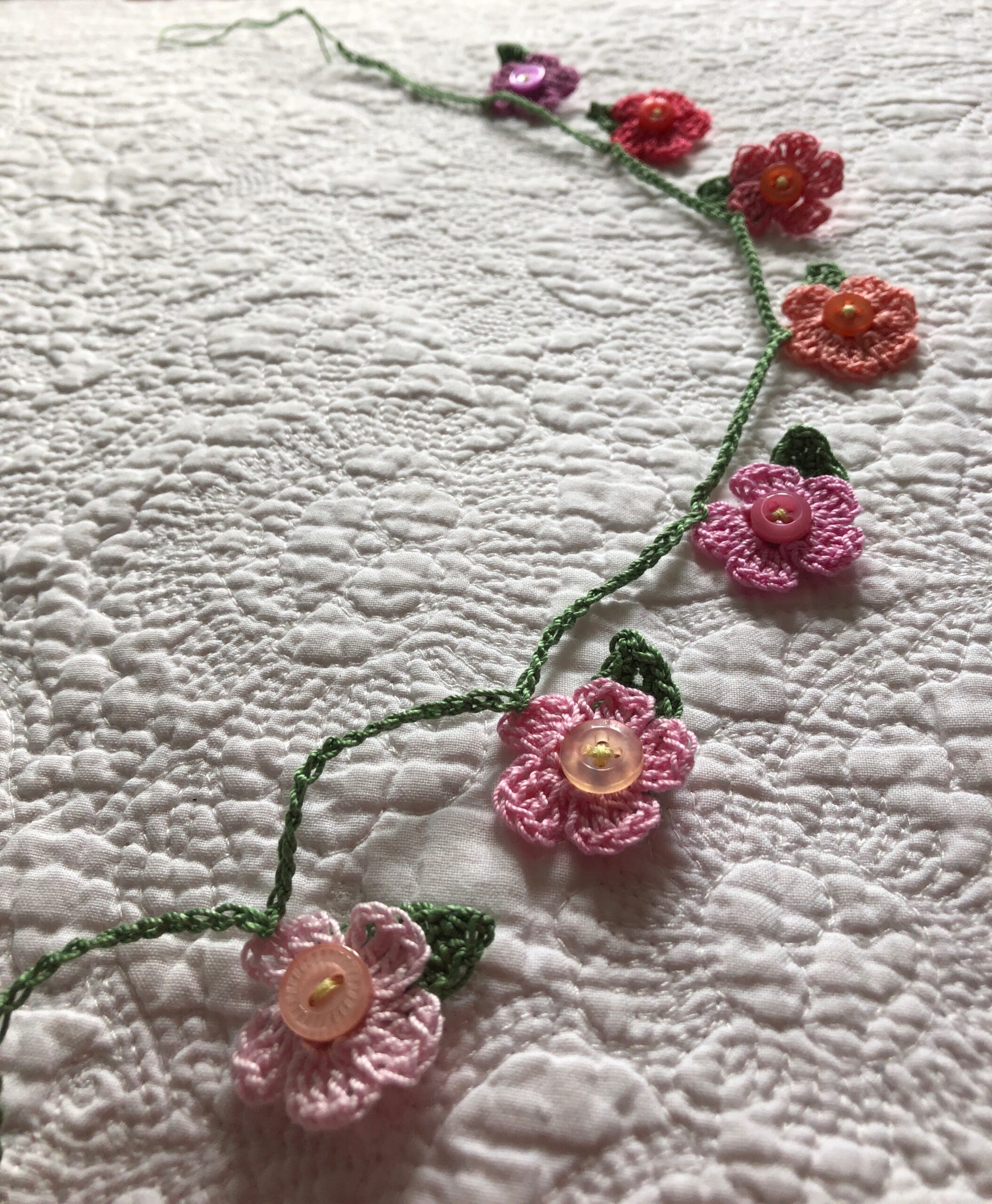 Tiny flower garland.