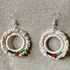 Hand made, crocheted, mini wreath earrings. Made using 100% cotton in natural cream colour with a mix of red and green glass beaded details. The earring hooks are made from a silver plated brass and are nickel, lead and cadmium free. Each earring measures approximately 3.5cm wide by 5.5cm Height (including hook).