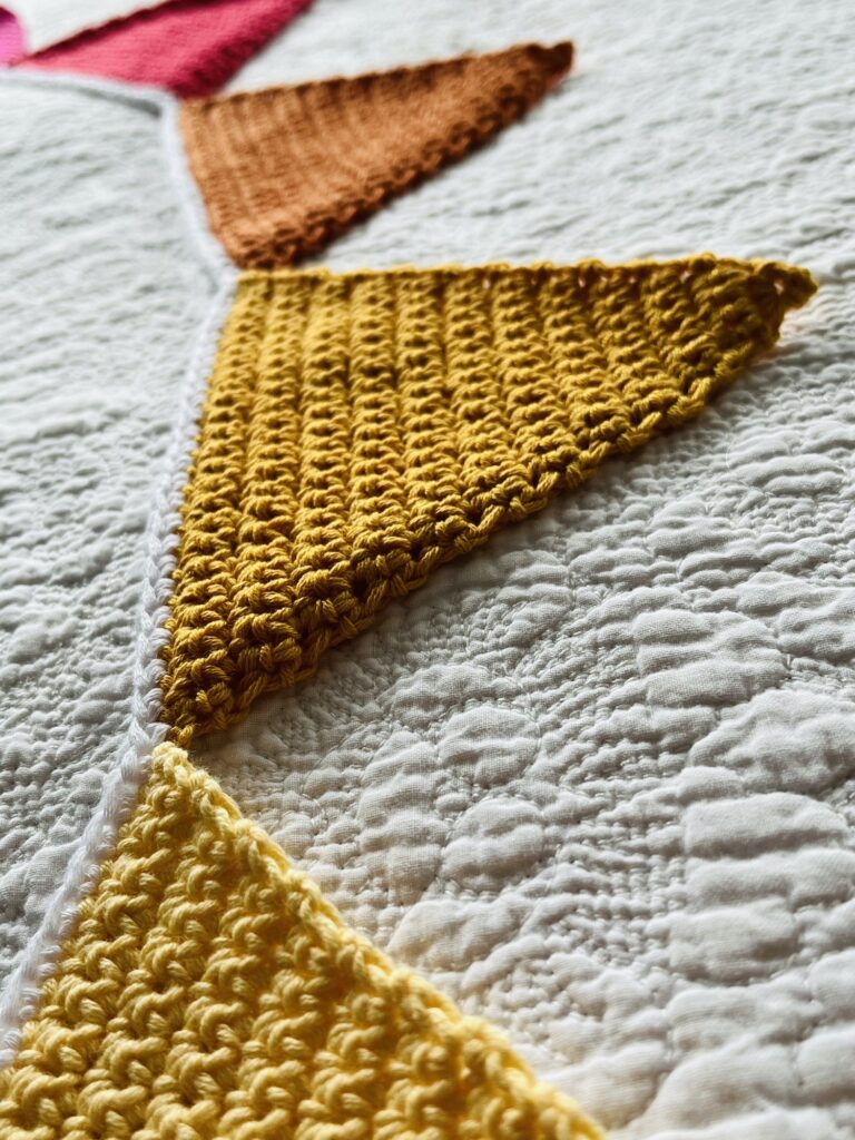 Handmade, crocheted bunting in a rainbow of beautiful colours. Made using 100% cotton.  Eco-friendly, recyclable, reusable and vegan friendly. 