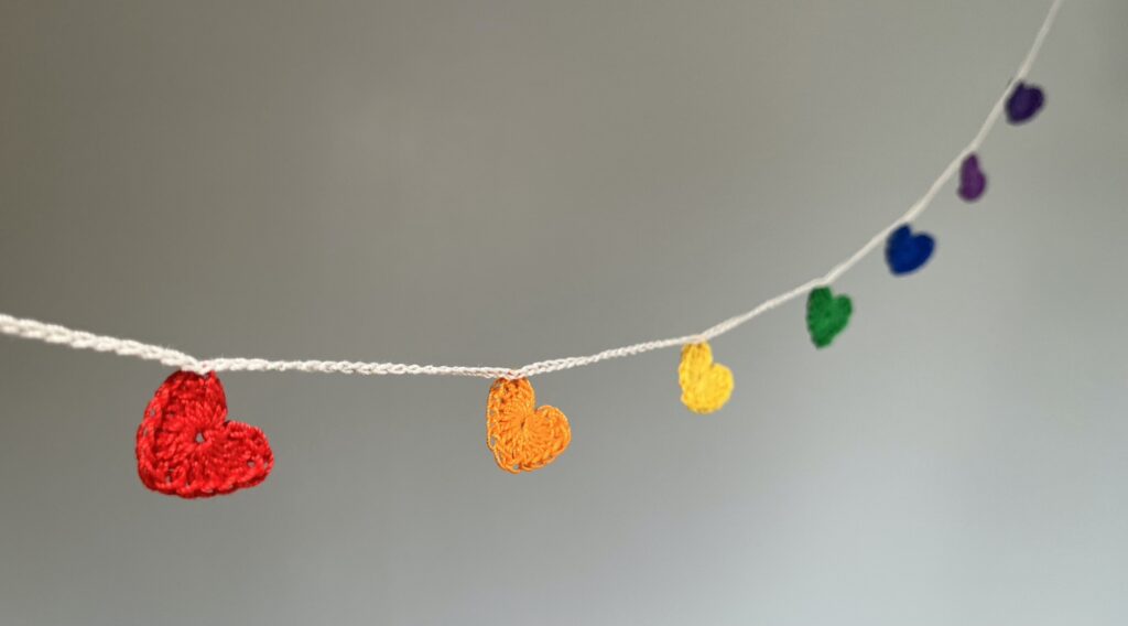 7 tiny crocheted hearts in a range of colours. They are  attached on a crocheted, natural cream cotton strand. Made in 100% cotton. Eco-friendly, vegan, recyclable, reusable. Total length approximately 67cm. Each heart measures approximately 2 x 2.5cm. 