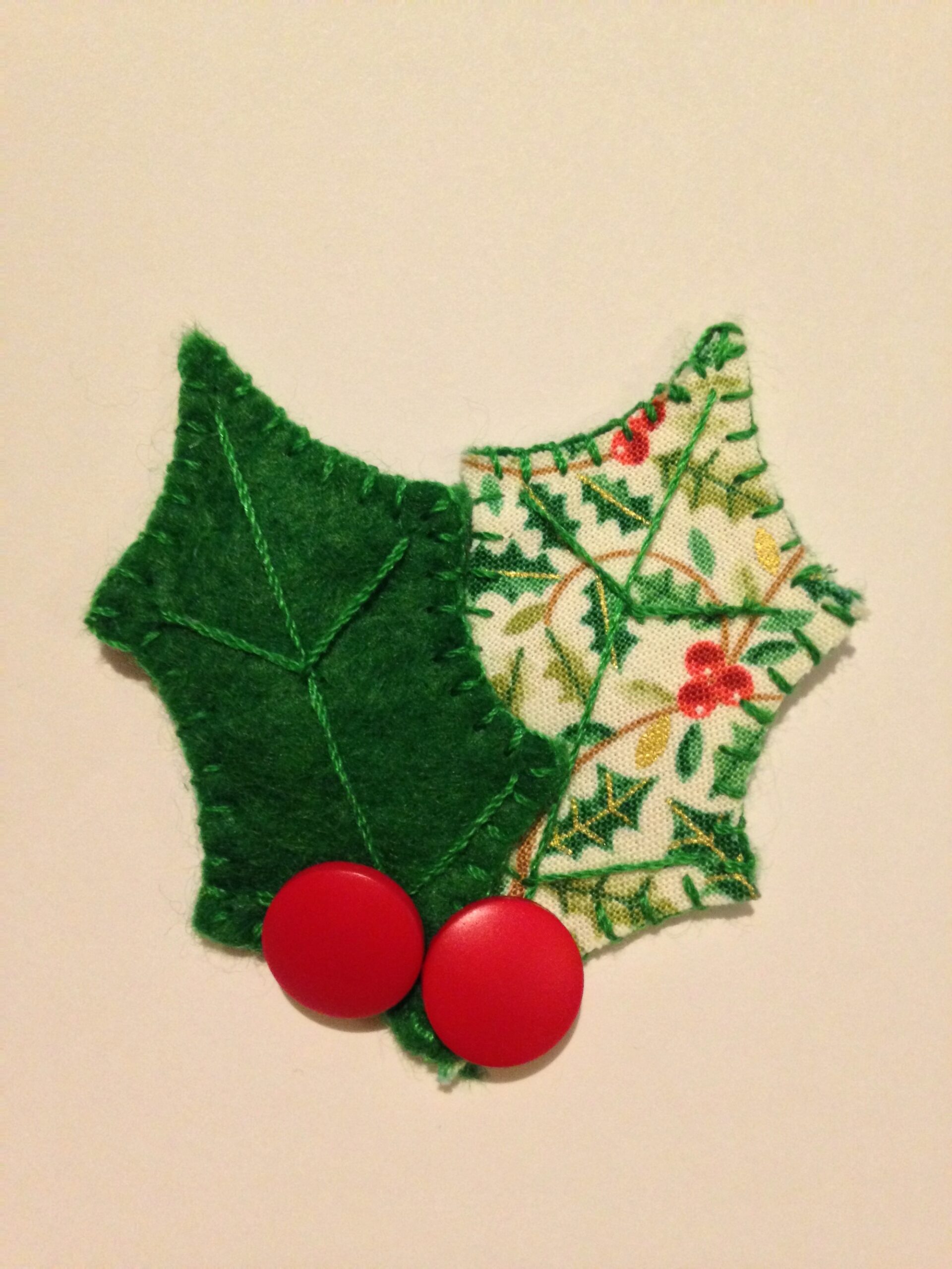 Holly brooch.