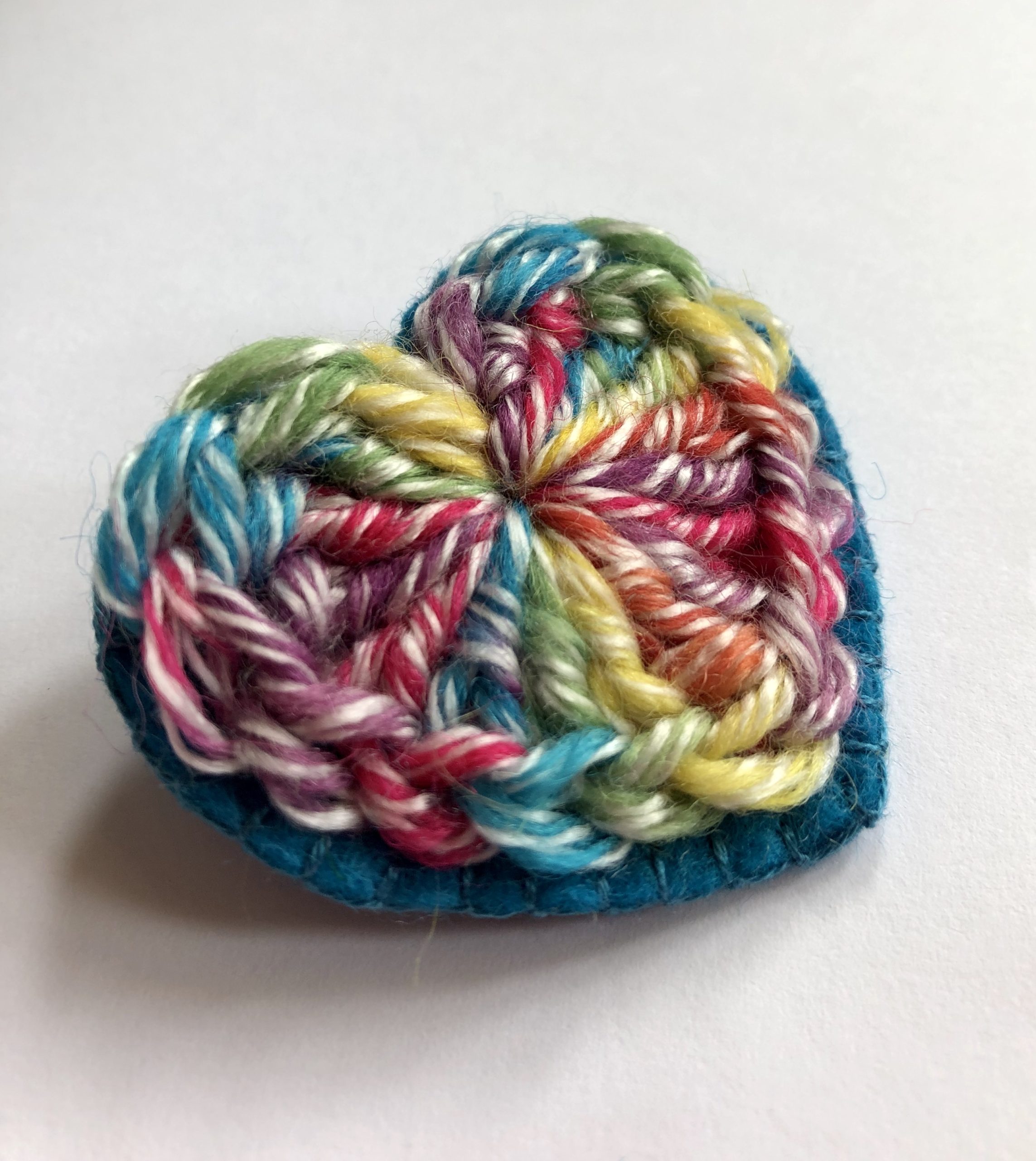 Rainbow heart brooch.