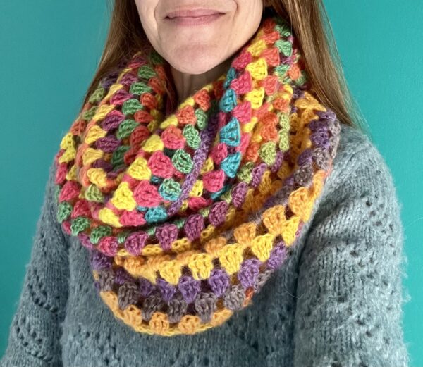 A handmade, crocheted double wrap around infinity scarf in a mix of spring inspired colours. Made using a beautifully lightweight and soft 80% acrylic and 20% wool mix yarn.