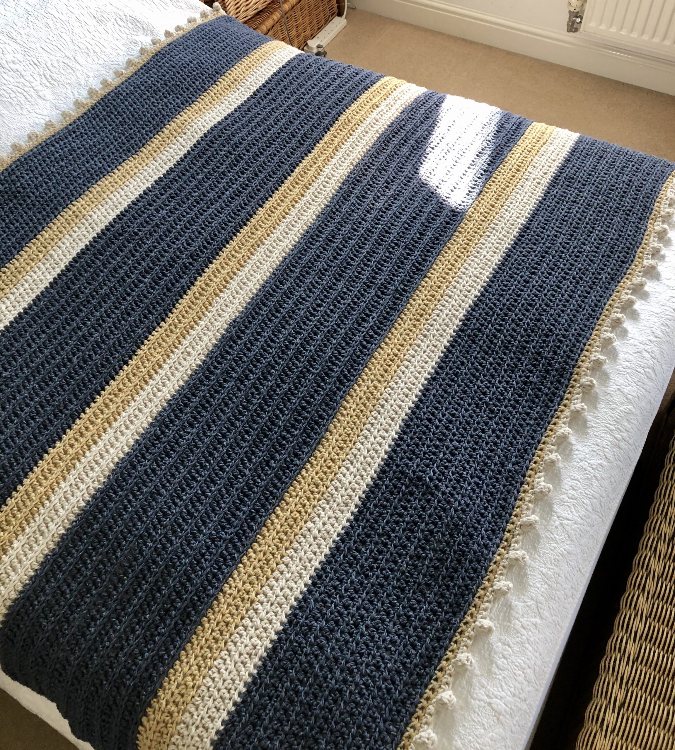 Mustard striped blanket.