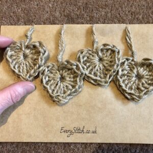 A set of 4 individual hanging heart decorations. Hand crocheted and made in 100% natural jute.