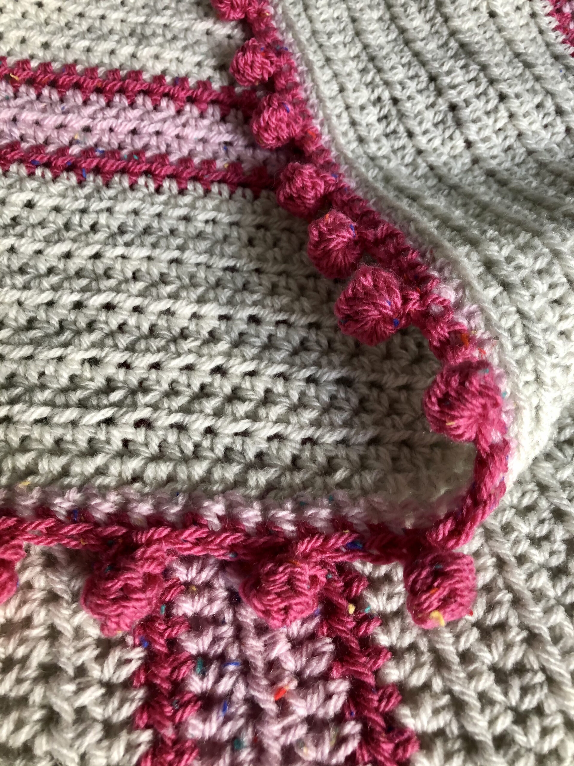 Pink striped blanket.