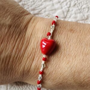 A single stranded, handmade and crocheted bracelet. Fully adjustable and made using ceramic and glass beads. Made from 100% Cotton,ceramic and glass beads. No plastic! Eco-friendly, vegan friendly and completely recyclable.