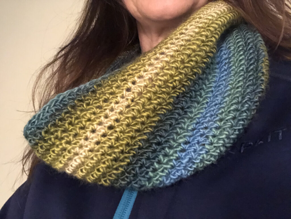 Handmade, crocheted neck warmer in a variegated colour combination. Made using a lightweight yet warm Acrylic yarn.