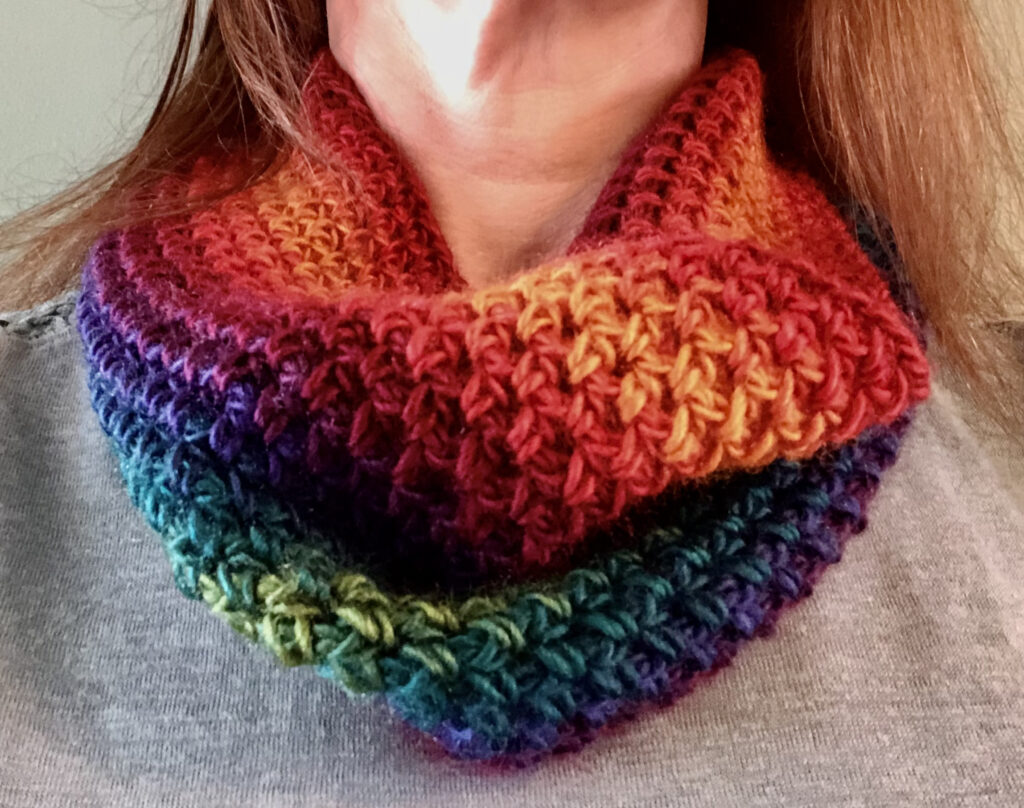 Handmade, crocheted neck warmer in a variegated colour combination. Made using a lightweight yet warm Acrylic yarn.
