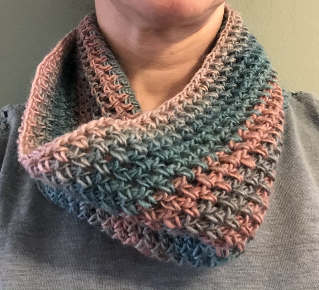 Handmade, crocheted neck warmer in a variegated colour combination. Made using a lightweight yet warm Acrylic yarn.