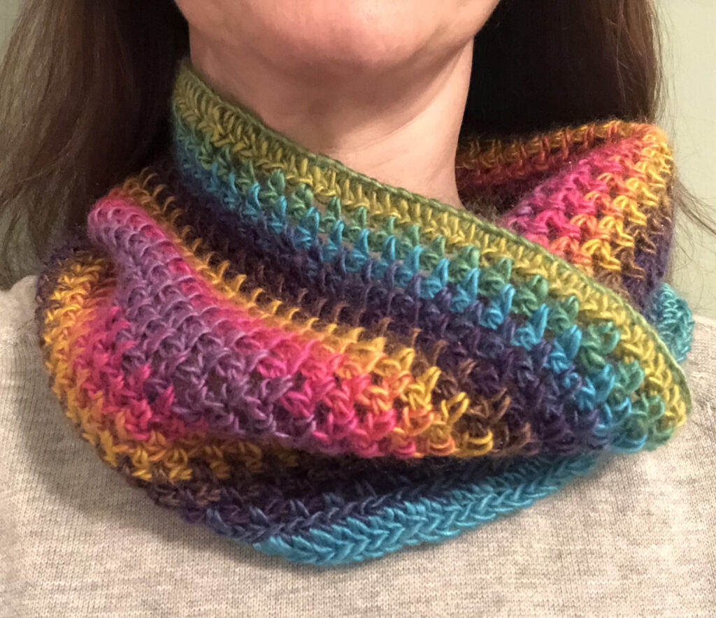 Handmade, crocheted neck warmer in a variegated colour combination. Made using a lightweight yet warm Acrylic yarn.
