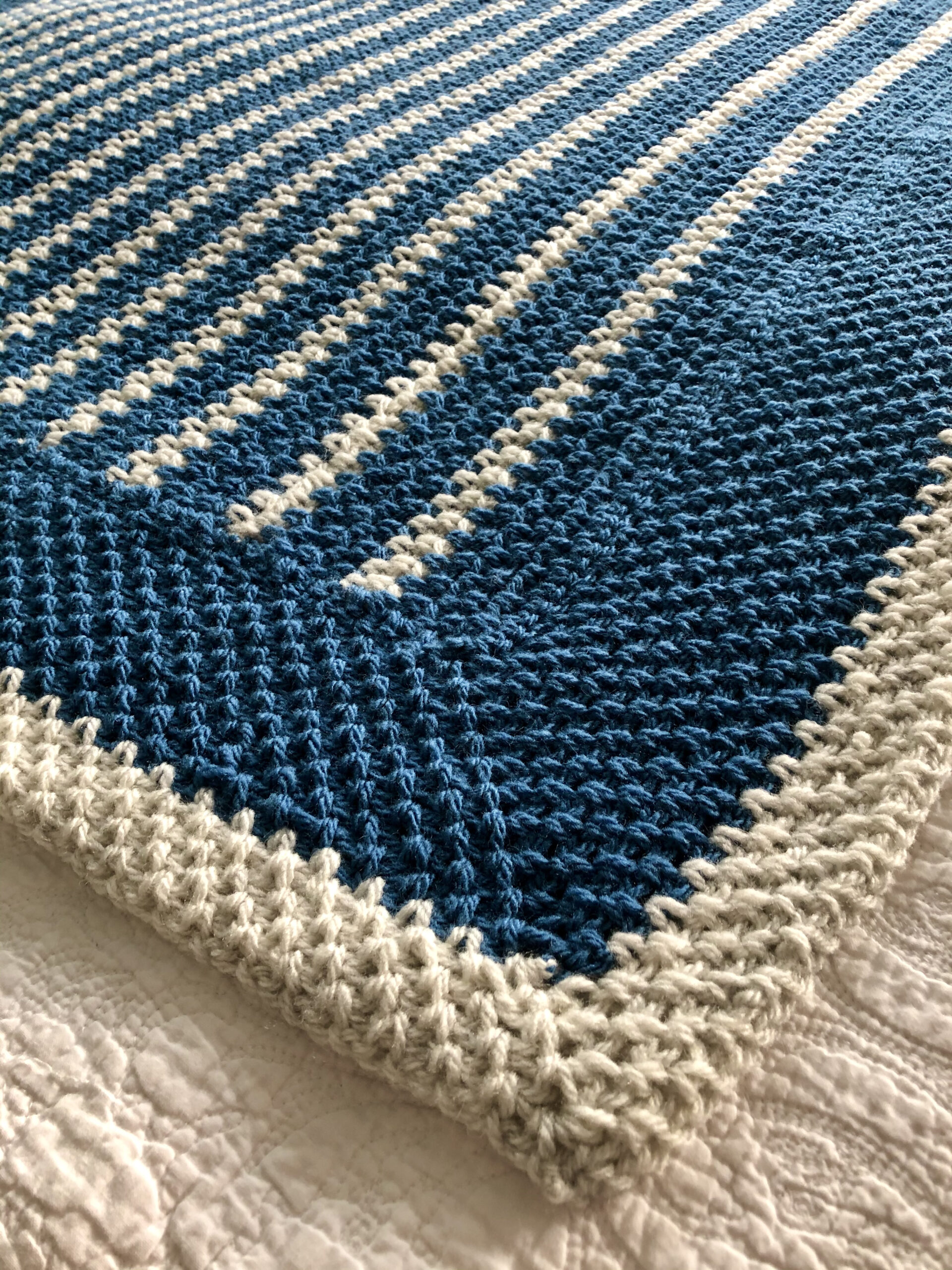 Denim and cream striped blanket.