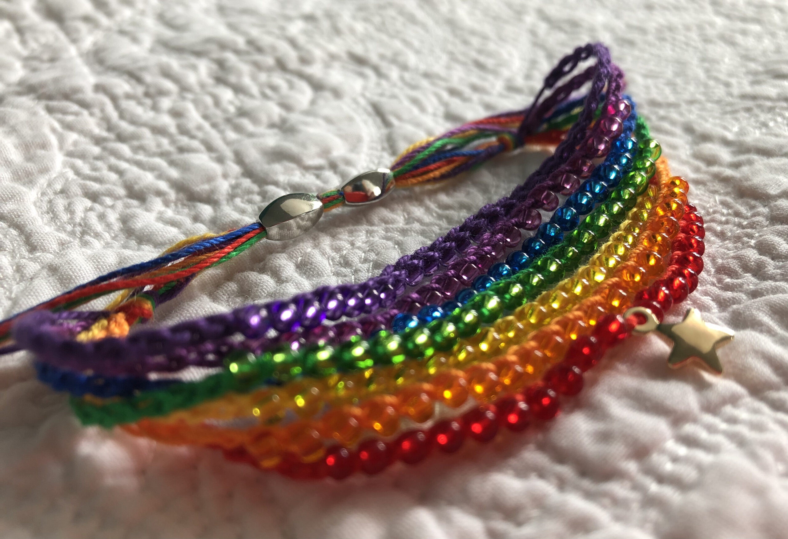 7 strand Rainbow bracelet with gold star.