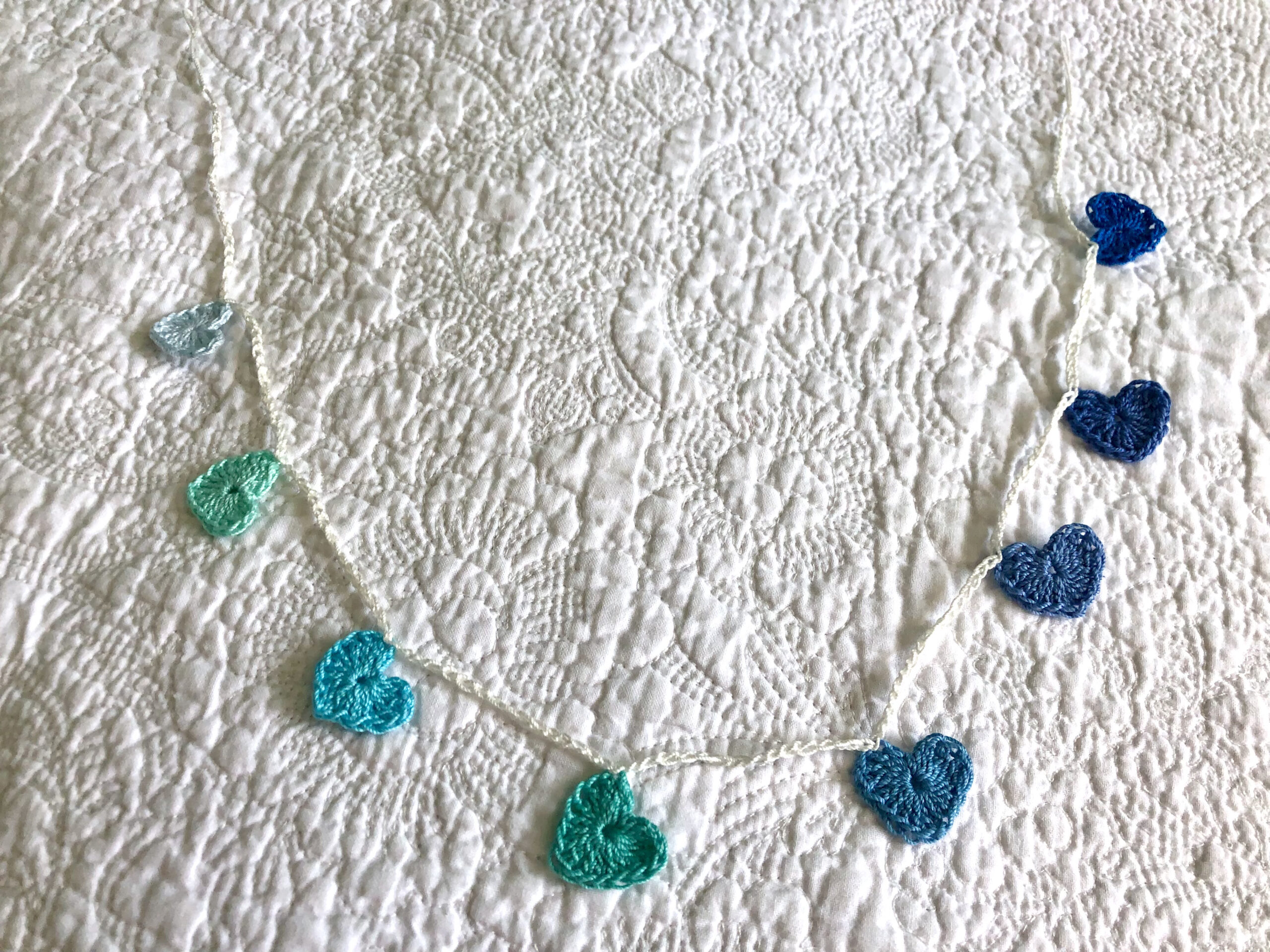 Tiny hearts garland in blues and greens.