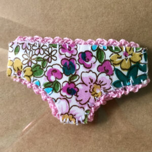 Handmade fabric and felt brooch with crocheted edging detail and a metal locking fastening. Approximate size 6cm Width x 4cm Height.